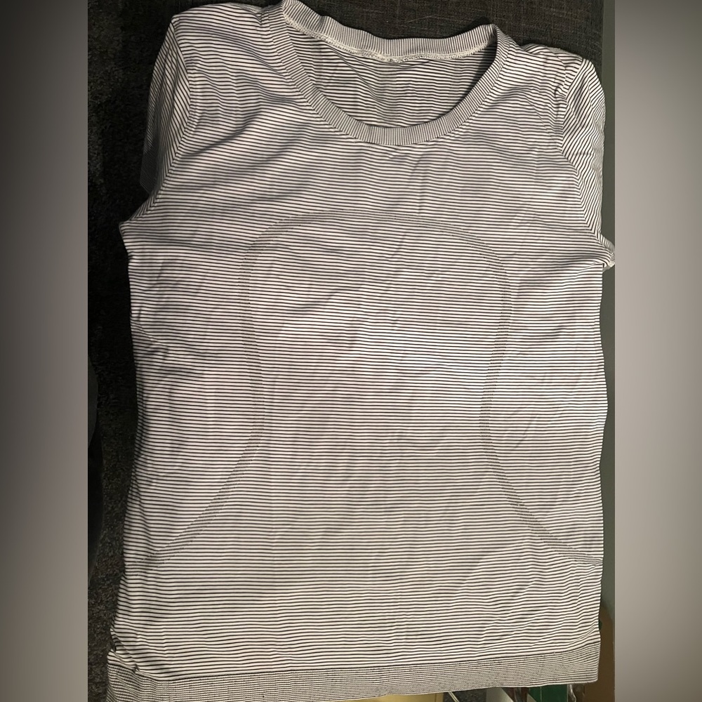 Lululemon swiftly relaxed size 10. EUC. One area that is “pulled” is pictured